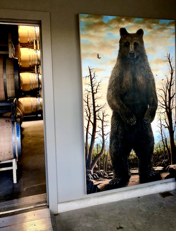 A room with an enormous painting of a bear standing upright seen on our tour Behind the Scenes at Stuhlmuller Vineyards