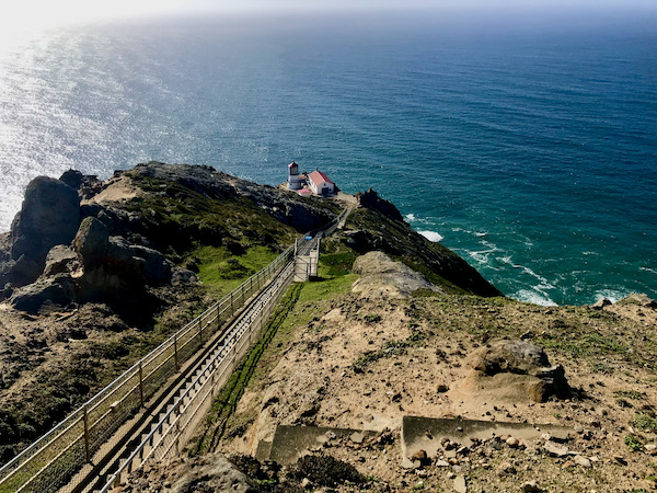 The Historic Point Reyes Lighthouse in the distance with ocean view.