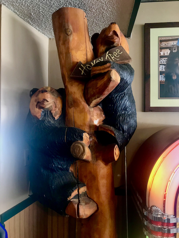 A carved wood tree with two bears climbing near Mt. Shasta and Shasta Lake California