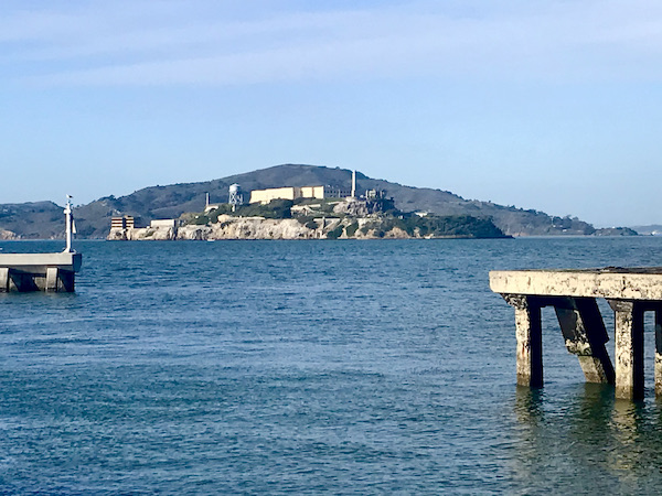 A large island with buildings in a large body of water in San Francisco California