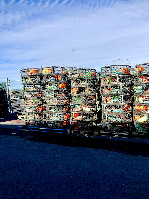 Rows and rows of crab traps stack and with colorful items inside in San Francisco California