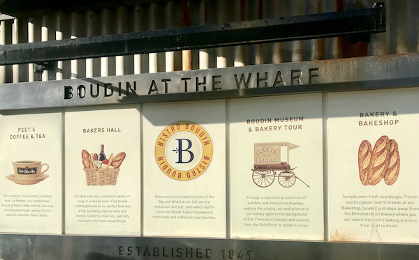 A bakery window with sheets of information in San Francisco California