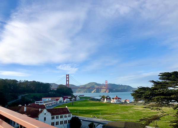 A cluster of white buildings and lawn with blue sky in ‎⁨H. Dana Bowers Memorial Vista Point⁩, ⁨Marin Headlands⁩, ⁨Sausalito⁩, ⁨California⁩, ⁨United States⁩