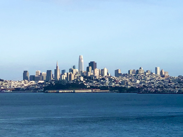 Blue water and the skyline of a large city called San Francisco California