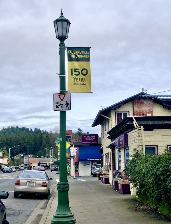 A small town with stores, mountains and trees on our way back from Sonoma Coast State Beach