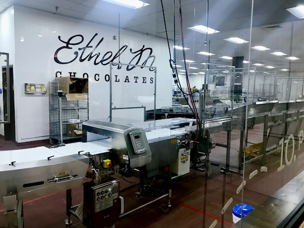 A glass partition separates visitors from the chocolate making equipment at this additional one of 15 Best Free Attractions Las Vegas NV