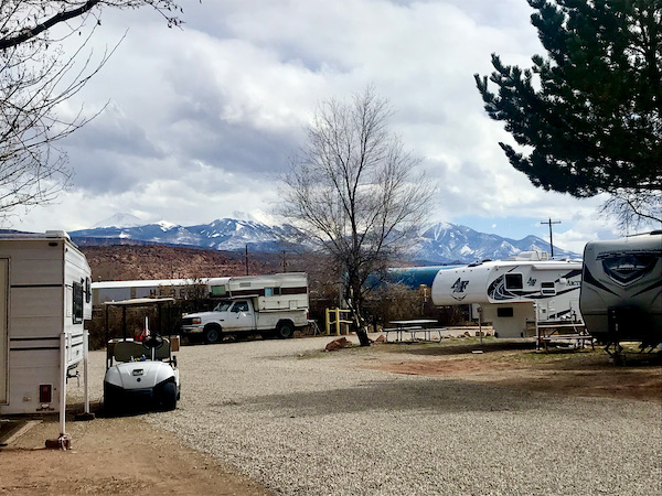 An RV park with view of snow capped mountains near Arches National Park Moab Utah