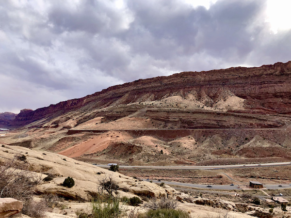 Mountains with varying colors that look like a patchwork quilt at Arches National Park Moab Utah