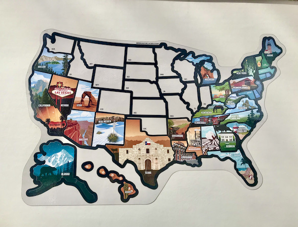 A map of the US with most states covered in stickers near Arches National Park Moab Utah