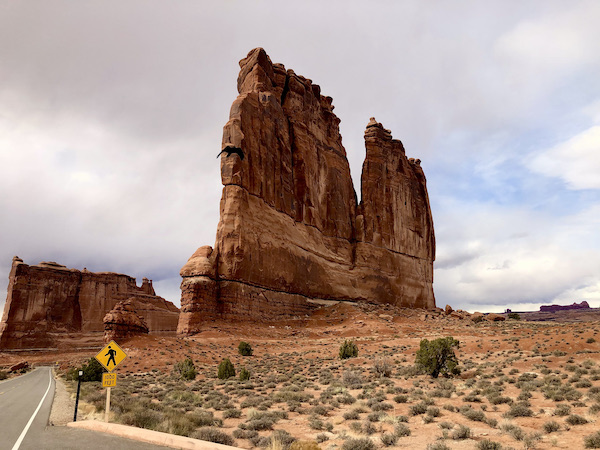 A formation of red rock that looks like a crumbling wall at Arches National Park Moab Utah