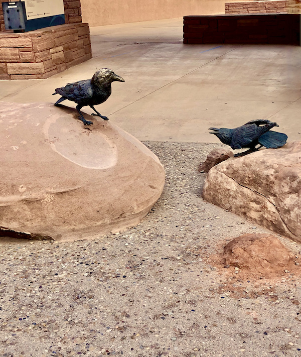A pair of bronze bird sculptures on rocks at Arches National Park Moab Utah
