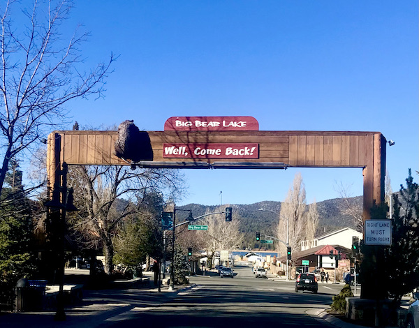 A cute wooden arch with the back of a bear in the town of Big Bear Lake California