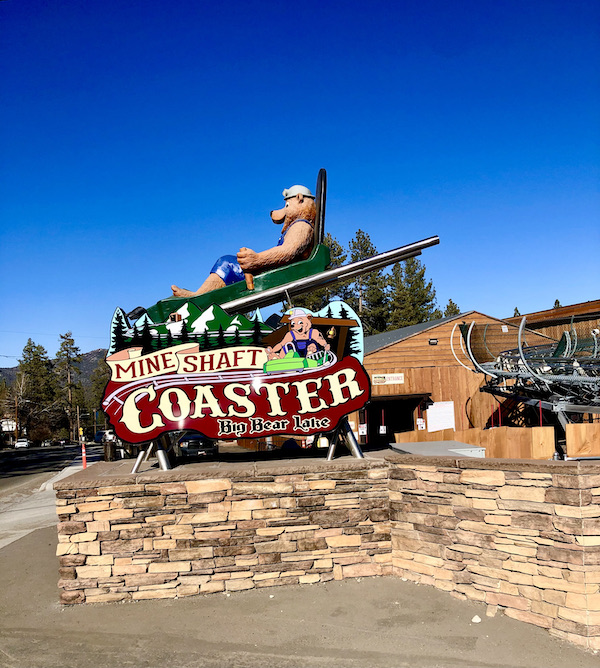 A huge 3-D sign with a big bear in a sled at 