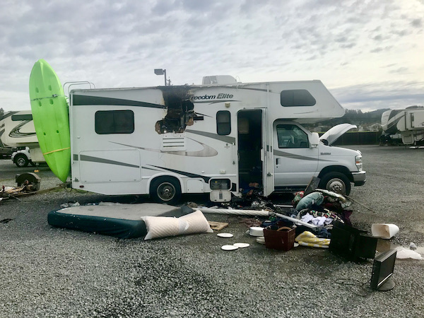 A fire damaged RV with interior items strewn on the parking lot by the RV the day after having dinner at Coyote Sonoma in Healdsburg CA