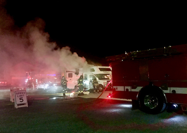 Smoke billowing from an RV with firefighters standing by after dinner at Coyote Sonoma in Healdsburg CA