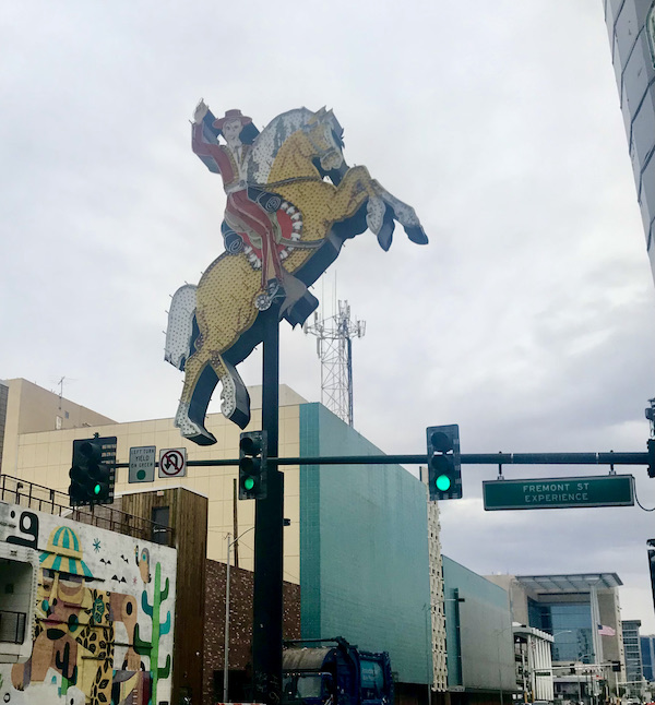 A large sign that is a cowboy atop a horse standing on his hind legs at Fremont Street Experience Las Vegas NV