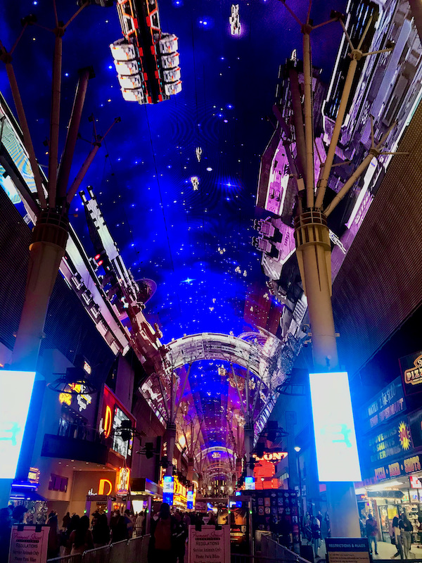 A deep blue video screen with space ships and planets floating by at the Fremont Street Experience Las Vegas NV