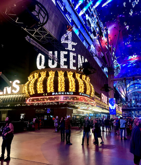 A brightly lit sign for the 4 queens casino at the Fremont Street Experience Las Vegas NV