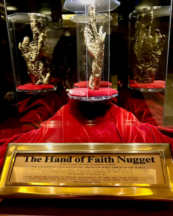 A red velvet covered platform with a huge gold nugget displayed at the Fremont Street Experience Las Vegas NV