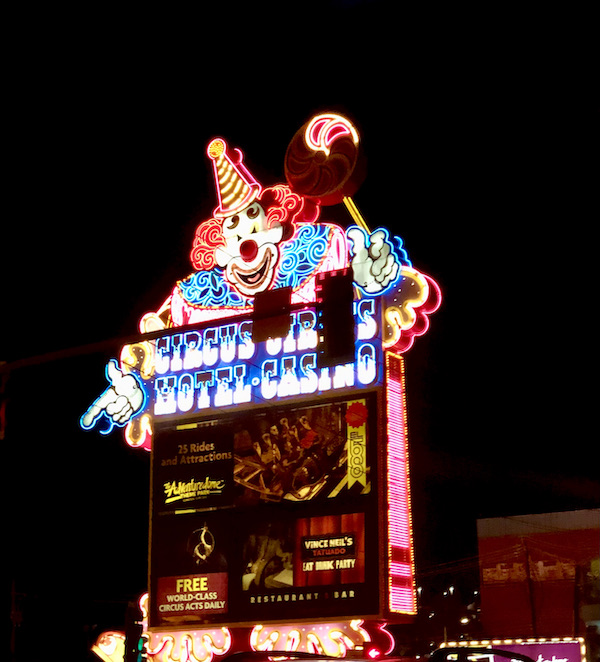A neon sign with a clown on our way to Fremont Street Experience Las Vegas NV