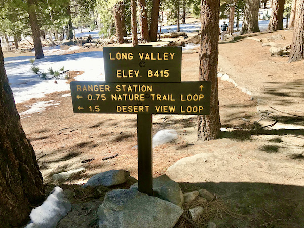 A sign stating the location and elevation at Palm Springs Aerial Tramway California