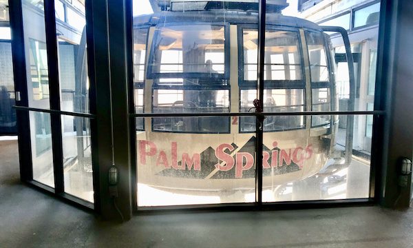 A mostly glass tramcar at the upper station at Palm Springs Aerial Tramway California