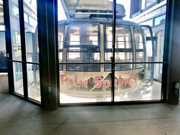 A mostly glass tramcar at the upper station at Palm Springs Aerial Tramway California