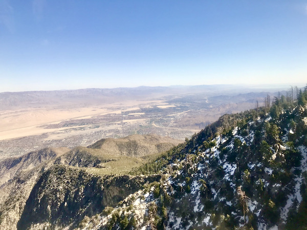 Snow dusted mountains, trees and a view that seems to go on for miles as we ride up to the summit in the Palm Springs Aerial Tramway California