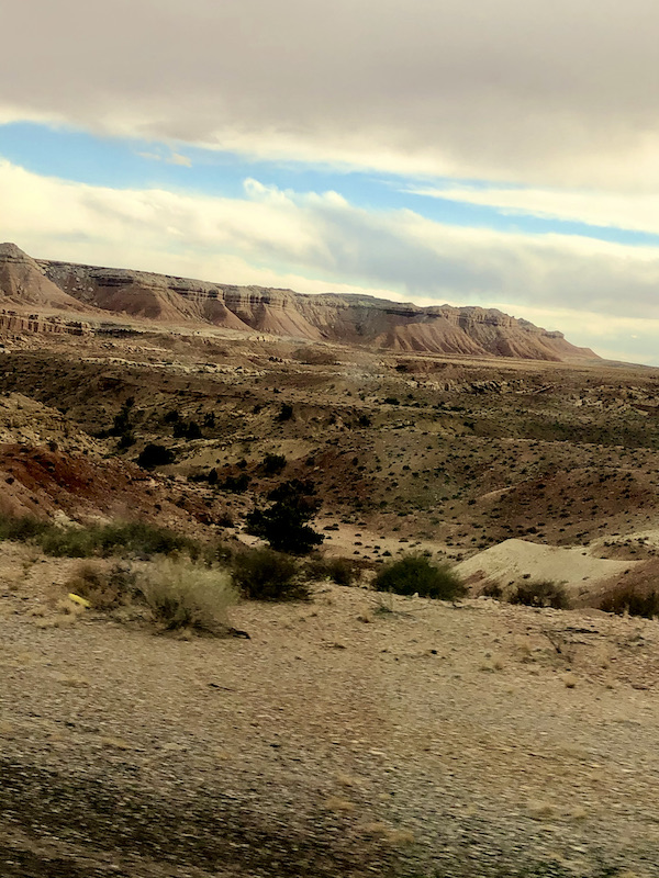 Clouds with blue sky and mountains on our Scenic Drive to Moab Utah