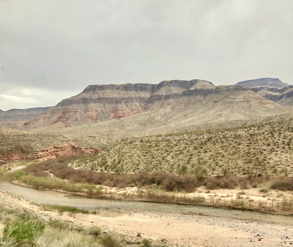 Layers of mountains, top section has black stripes along our Scenic Drive to Moab Utah