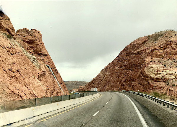 Curvy highway though red rock mountains on our Scenic Drive to Moab Utah