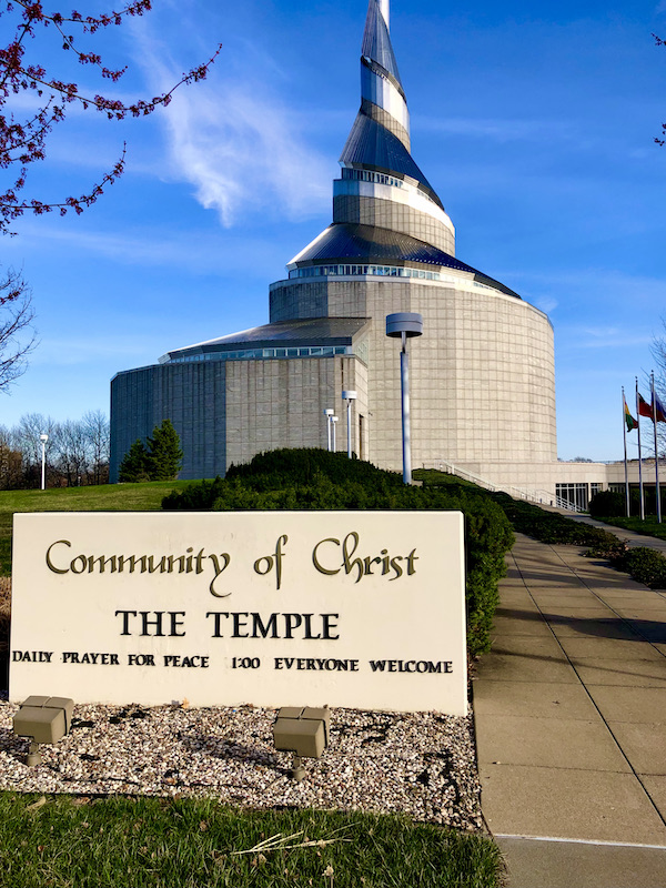 A large church on a hill with a sign in front is one of the Attractions in Independence Missouri