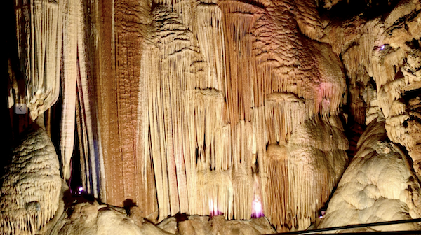 Stalactites and stalagmites form a curtain in the theater of Meramec Caverns Stanton Missouri
