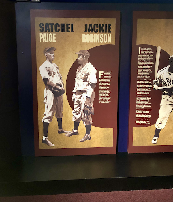 A wall hanging of two baseball players at the Negro Leagues Baseball Museum