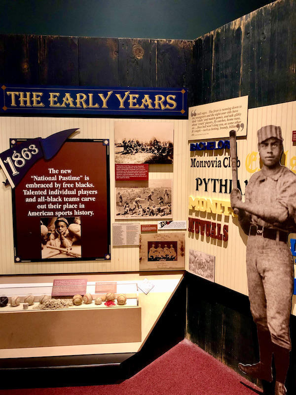 A wall of information about the early years at the Negro Leagues Baseball Museum
