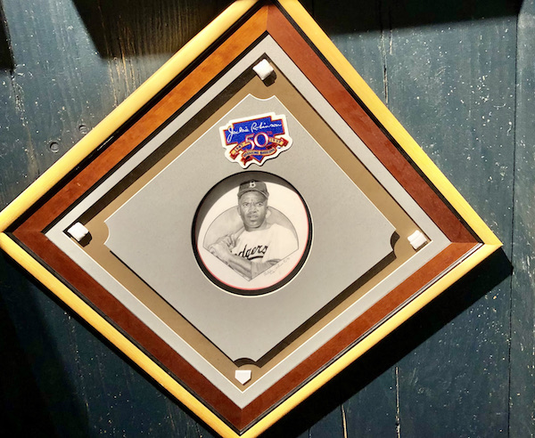 A wall plaque with a picture of Jackie Robinson at the Negro Leagues Baseball Museum