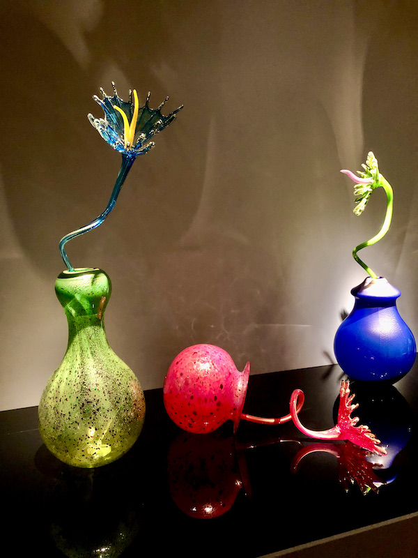 Colored glass vases and flowers at the OKC Museum of Art Dale Chihuly Exhibit