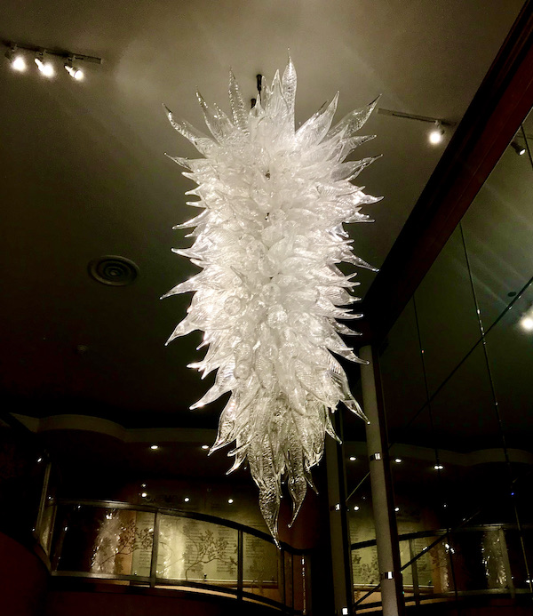 A contemporary white crystal Chandelier at the OKC Museum of Art Dale Chihuly Exhibit