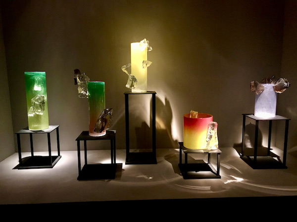 Colored glass pillars that resemble candles on risers at the OKC Museum of Art Dale Chihuly Exhibit