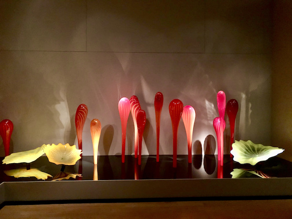 Deep pink and pale green glass calla lilies and leaves at the OKC Museum of Art Dale Chihuly Exhibit