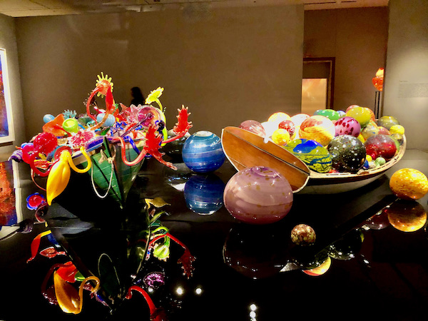 These Float Boats, row boats filled with colorful glass objects, are part of the OKC Museum of Art Dale Chihuly Exhibit