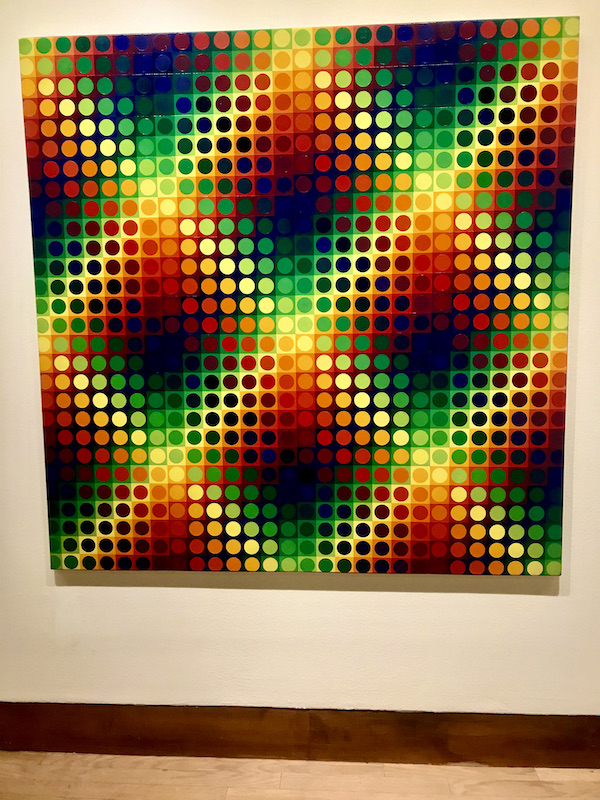 A painting of multicolored dots that form a grid at the Oklahoma City Museum of Art