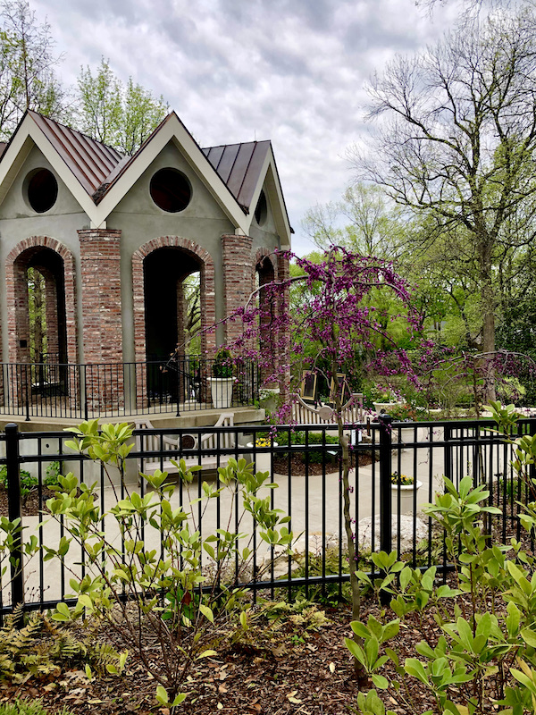 A red brick gazebo surrounded by a wrought iron fence at Cheekwood Estate Nashville TN