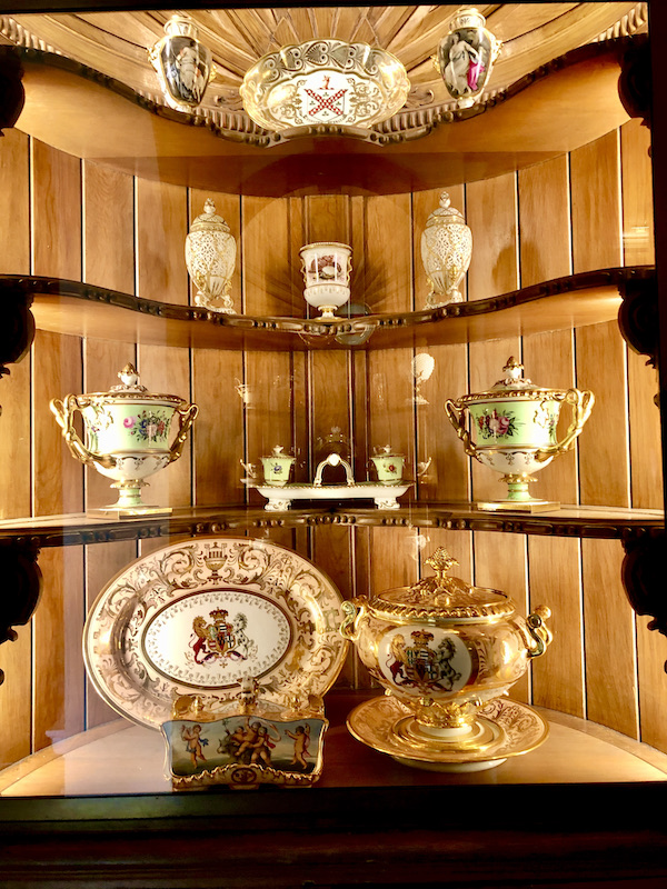 A corner with shelves that display serving pieces at Cheekwood Estate Nashville TN