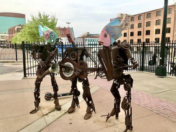 A trio of musicians sculptures made from metal found objects.