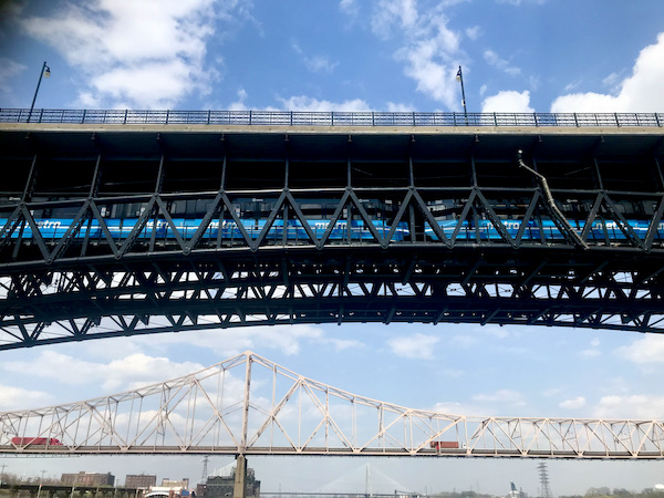 Bridges with cars, truck and trains crossing the Mississippi River near the Gateway Arch Saint Louis MO