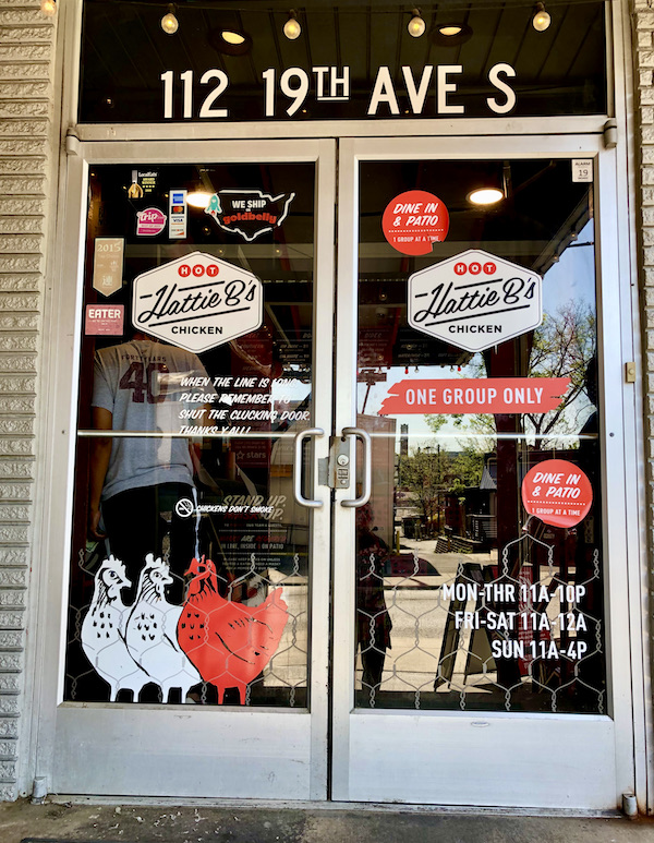 The glass entry doors to Hattie B's Nashville Hot Chicken