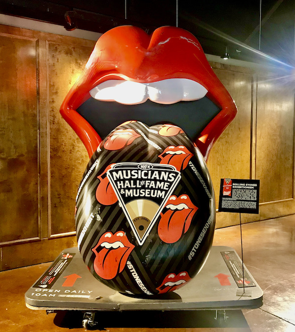 A bright red mouth with long tongue hanging out in tribute to the Rolling Stones.