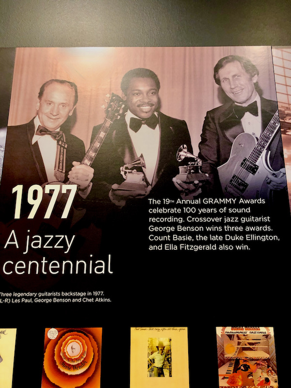 A photo of George Benson, and 2 other musicians receiving Grammy Awards in 1977