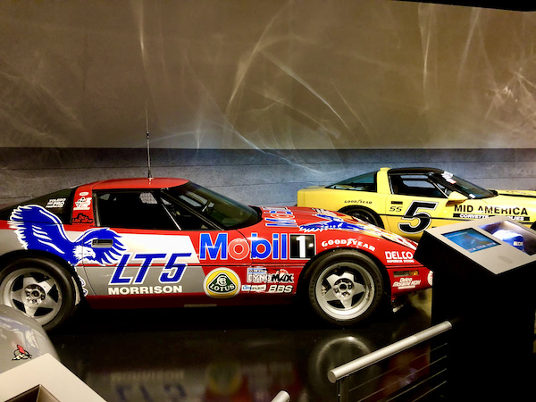 A red and a yellow racing car at the National Corvette Museum